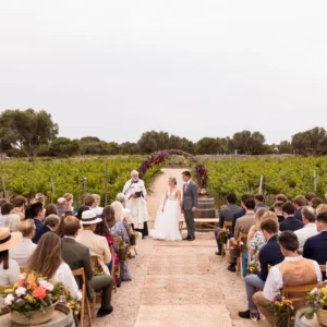 Coastal wedding ceremony set up on a Menorca clifftop overlooking the sea