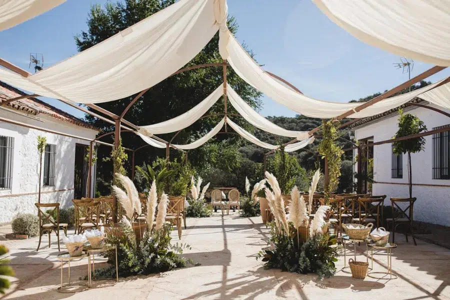 Ceremony seating between stone columns overlooking the valley