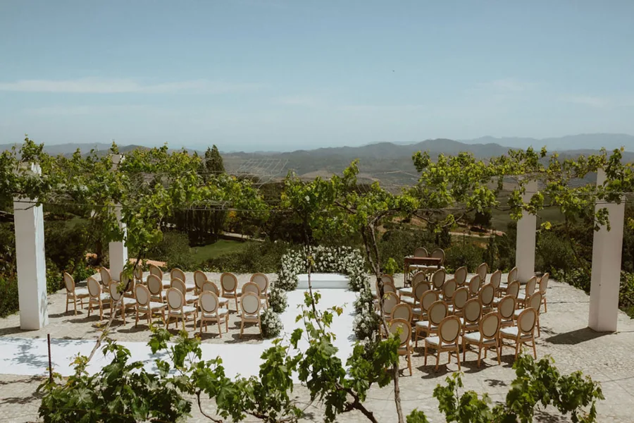 Wedding reception under a canopy of fairy lights at dusk