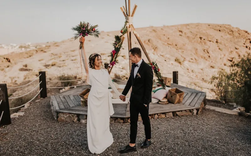 Couple celebrating in a volcanic landscape