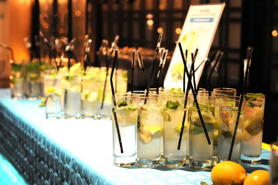 Row of cocktails prepared on a mobile bar counter