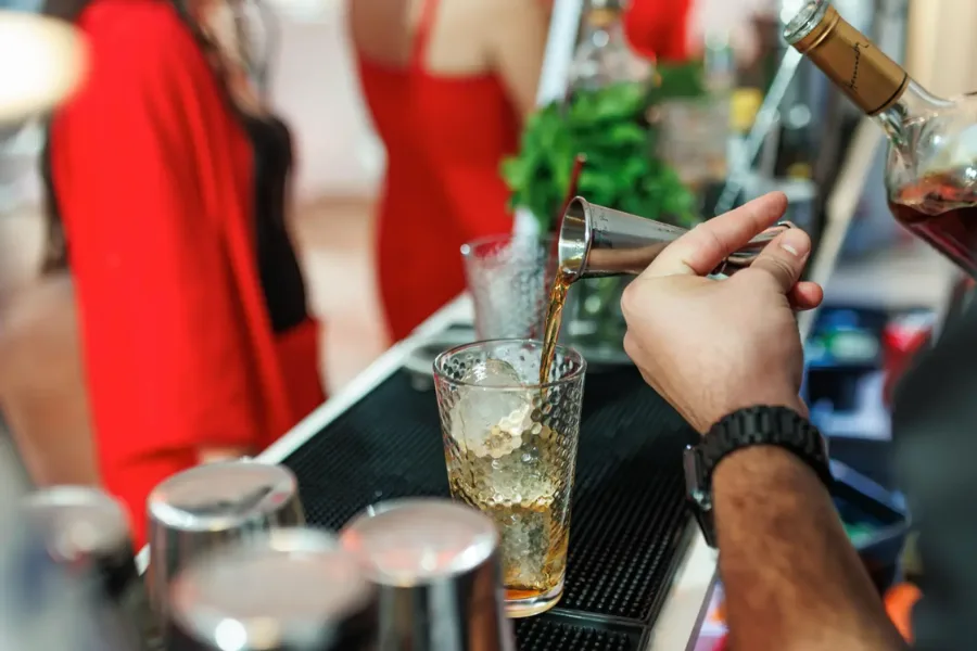 Guests holding cocktails at a wedding drinks reception